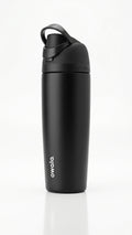 Owala FreeSip Tumbler with travel-grip handle in Black, hero shot