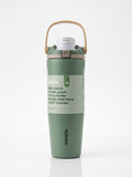 Owala FreeSip Tumbler with travel-grip handle in Olive Green, hero shot