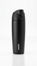 Owala FreeSip Tumbler with travel-grip handle in Peach, hero shot